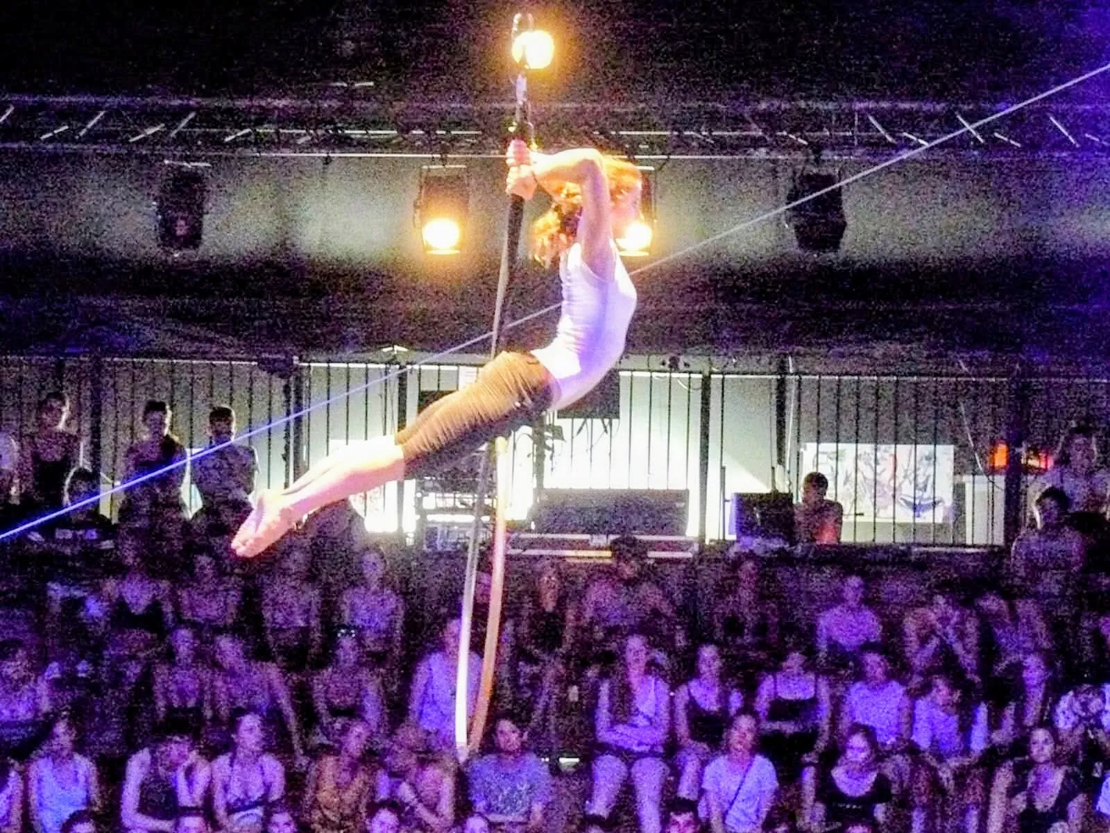 An aerial performer hangs above a crowd during the Sziget Festival in Budapest.